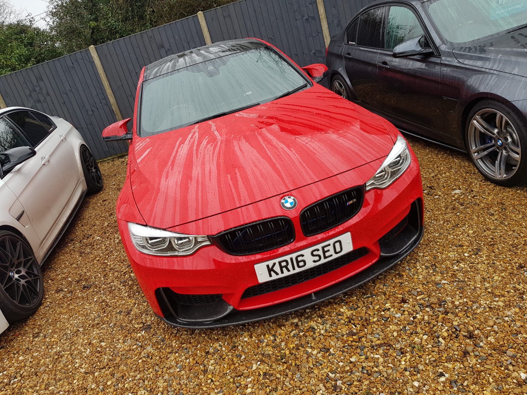 Front view of a red BMW M car protected by Prime Motive