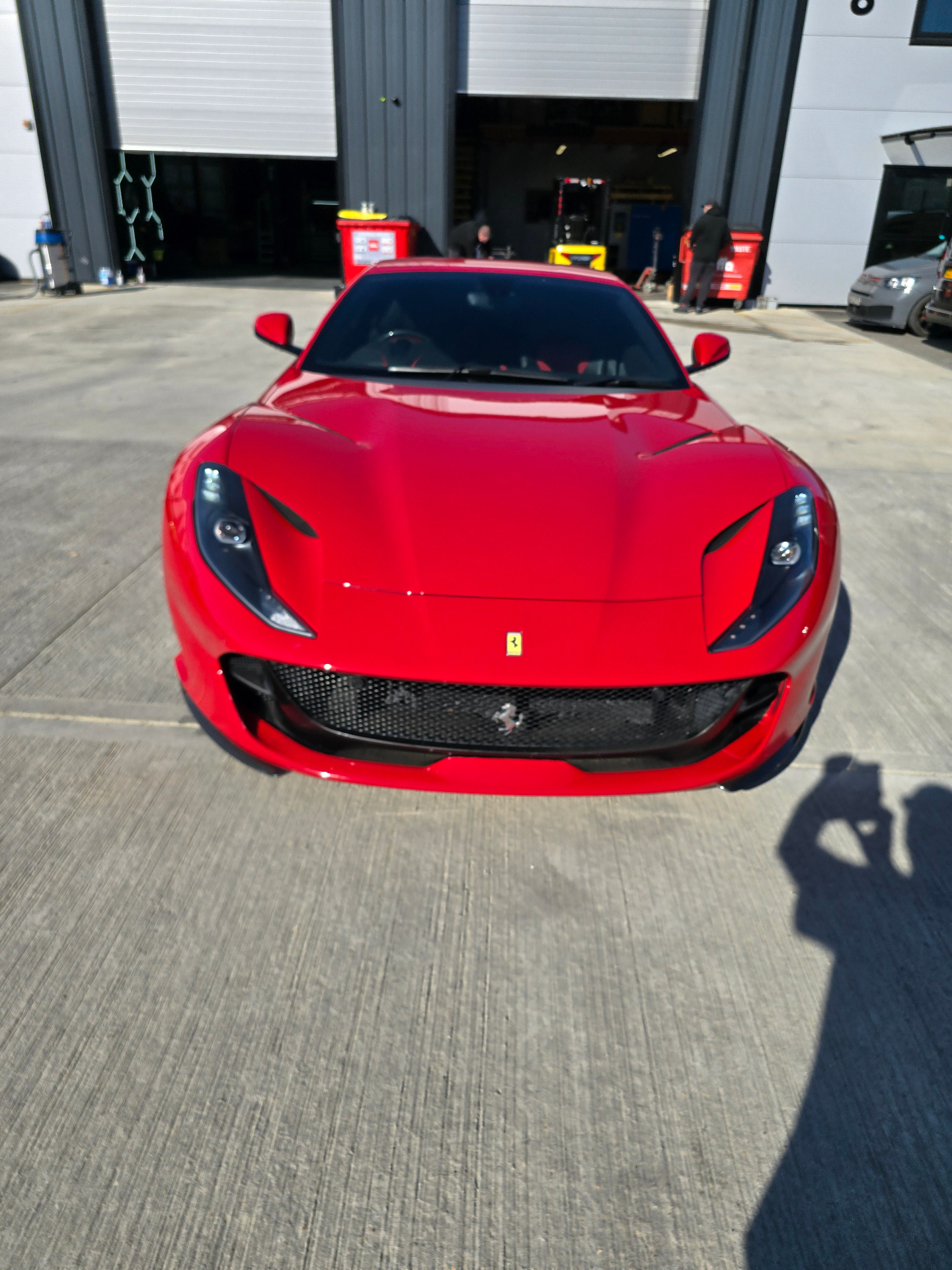 Red Ferrari 812 at a Prime Motive installation